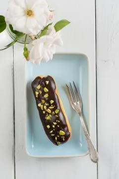 Chocolate pistachio eclair Stock Photos