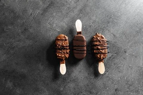 Chocolate Popsicles on Black Background Stock Photos