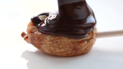 Chocolate is poured on the figs Stock Footage 146487150