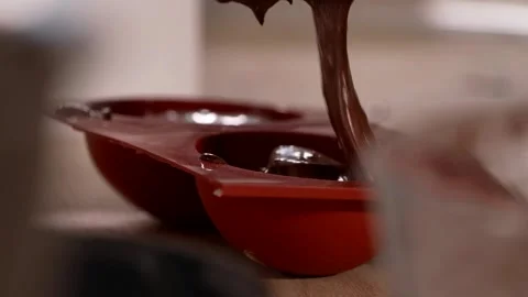 Chocolate poured into the mold Stock Footage 266712525