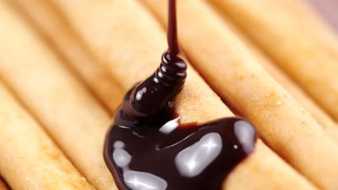 Chocolate pouring on bread stick in 4K Resolution Video stock 130839371