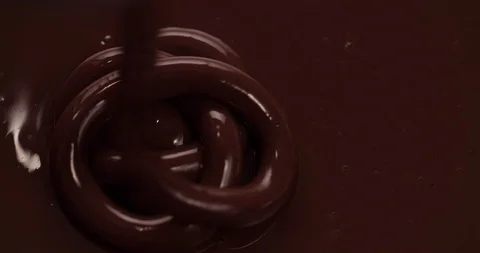 Chocolate is pouring on chocolate surface Close up Macro shot Stock Footage 108814423
