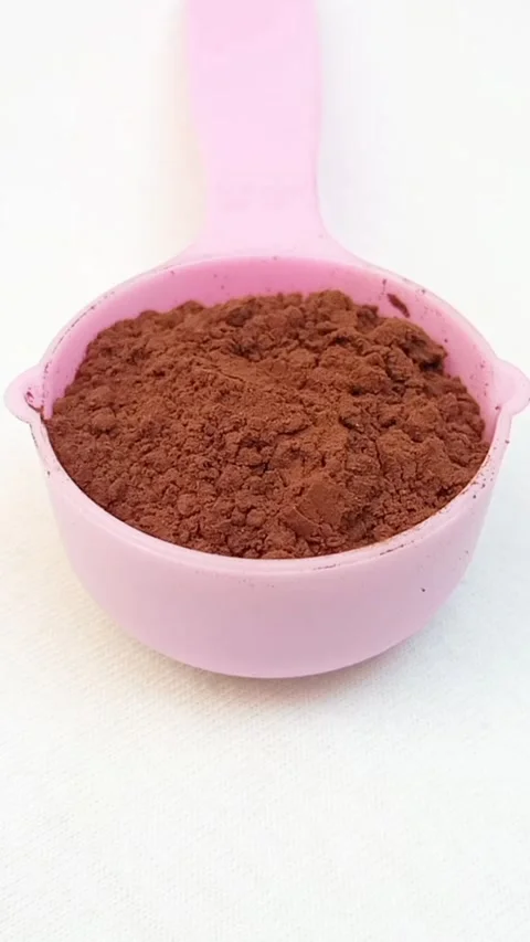 Chocolate Powder in Measuring Cup Moving on White Background, Cocoa Powder .. Stock Footage 340550789