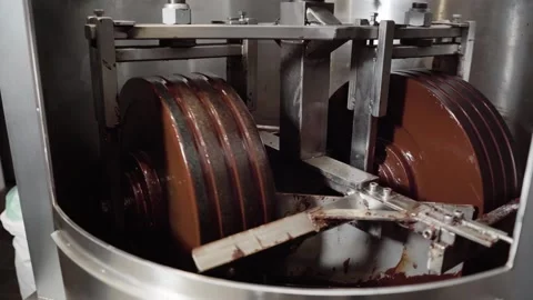 Chocolate Processing In Conching Machine. Chocolate Industry. closeup shot Stock Footage 282428309