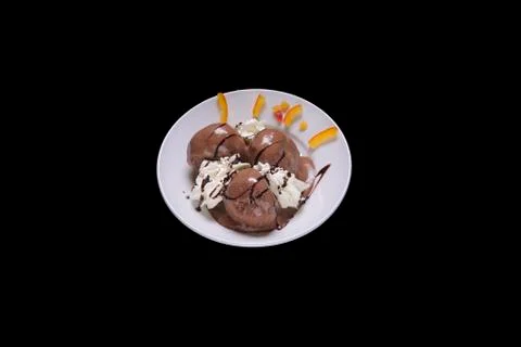 Chocolate profiteroles Stock Photos