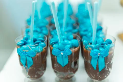 Chocolate pudding brown into cup plastic on white background. Stock Photos