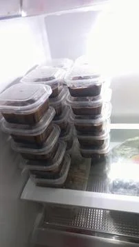 Chocolate Pudding Cups in 120 ml Plastic Containers Stored in Refrigerator Stock Photos