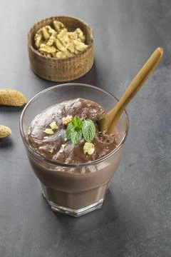 Chocolate pudding with mint and walnuts Stock Photos