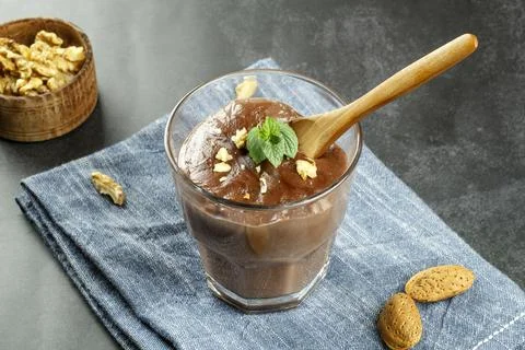 Chocolate pudding with mint and walnuts Stock Photos