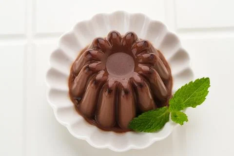 Chocolate pudding with mint leaf Stock Photos