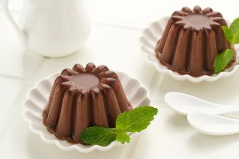 Chocolate pudding with mint leaf Stock Photos