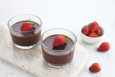 Chocolate pudding with strawberries  Stock Photos
