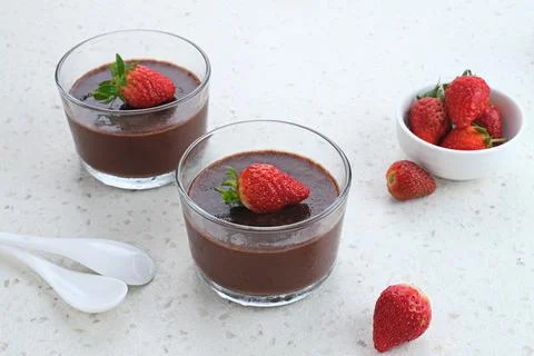 Chocolate pudding with strawberries  Stock Photos