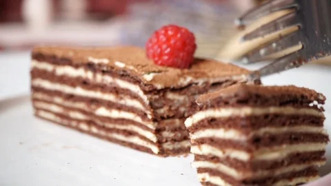 Chocolate puff cake piece with small sweet raspberry Stock Footage 118460034