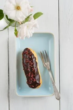 Chocolate raspberry eclair Stock Photos