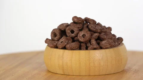 Chocolate rings rotating on white background. Video stock 146390214