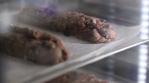 Chocolate roll in a baking cabinet. Stock Footage 121044731