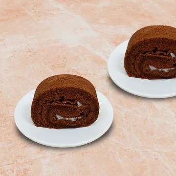 Chocolate rolled sponge cake on a white plate Stock Photos