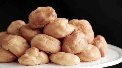 Chocolate sauce being poured over profiteroles Stock Footage 24673468