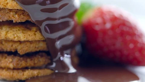 Chocolate sauce dripping over stack of cookies. Stock Footage 92152228