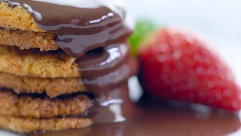 Chocolate sauce dripping over stack of cookies. Stock Footage 92156975