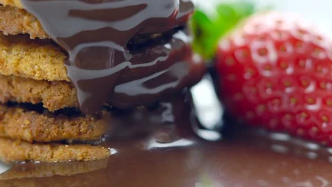 Chocolate sauce dripping over stack of cookies. Stock Footage 92158539