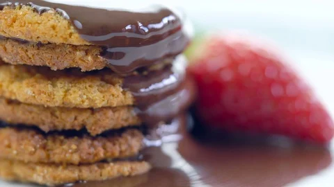 Chocolate sauce dripping over stack of cookies. Stock Footage 92183813