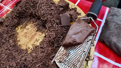 Chocolate Shaving Process Close Up with Grater on Street Dessert Stall 4K Video stock 332636047