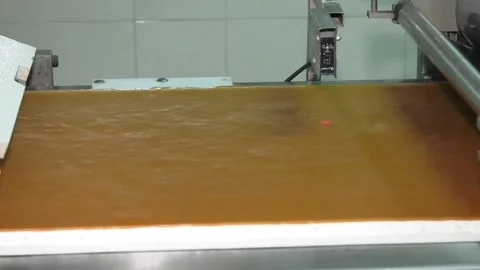 Chocolate slitting machine. High quality protein bar forming line. Stock Footage 234583700