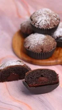 Chocolate Smurf Bread sprinkled with powdered sugar and chocolate paste inside Stock Photos