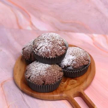 Chocolate Smurf Bread sprinkled with powdered sugar and chocolate paste inside Stock Photos
