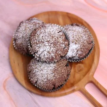 Chocolate Smurf Bread sprinkled with powdered sugar and chocolate paste inside Stock Photos