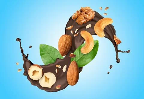 Chocolate splash with nuts on light blue gradient background Stock Photos