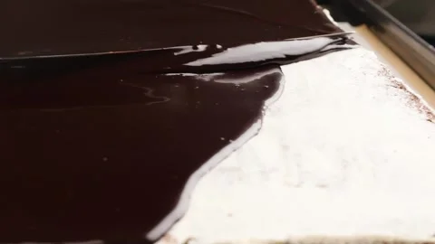Chocolate is spread on the cake Stock Footage 260867558