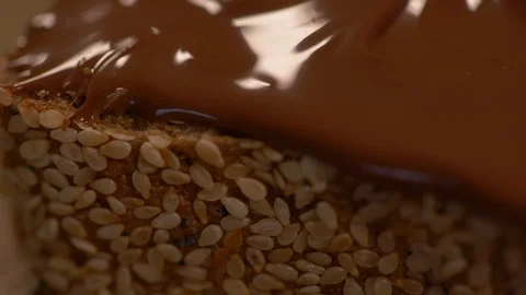 Chocolate Spread on a Multi Grain Loaf Of Bread Video stock 130153158
