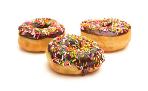 Chocolate Sprinkle Donuts on a White Background Foto stock