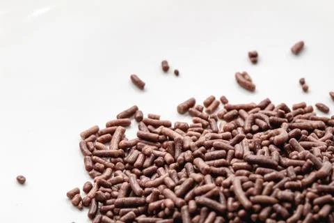Chocolate sprinkles background. Stock Photos