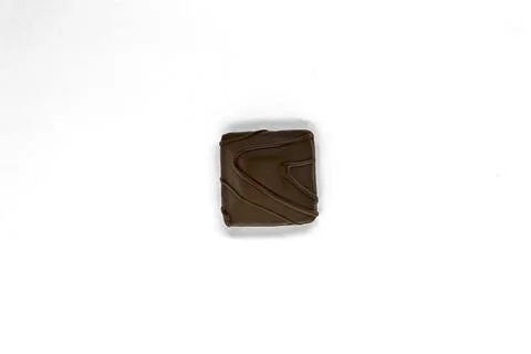 Chocolate square candy view from top close up on white background Stock Photos
