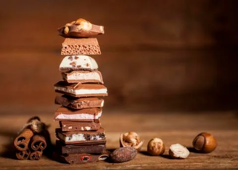 Chocolate stack on wooden background Stock Photos