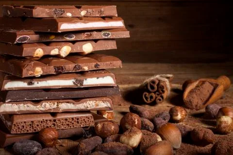 Chocolate stack on wooden background Stock Photos