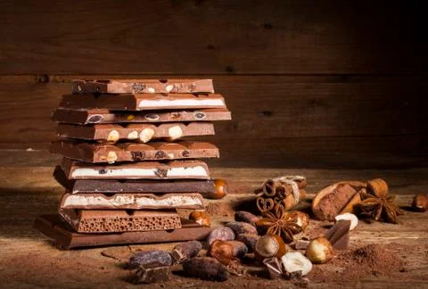 Chocolate stack on wooden background Stock Photos