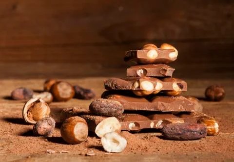Chocolate stack on wooden background Stock Photos