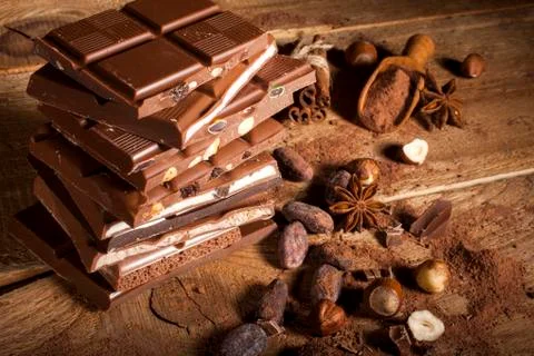 Chocolate stack on wooden background Stock Photos