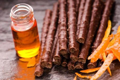 Chocolate sticks with orange Stock Photos