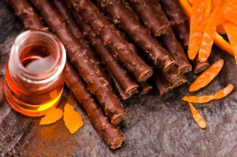 Chocolate sticks with orange Stock Photos