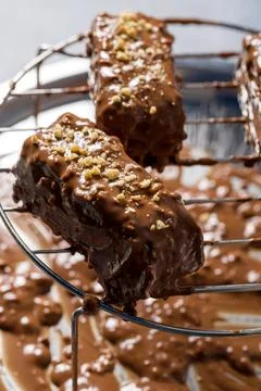Chocolate sticks with peanuts. Decorating with peanuts Stock Photos