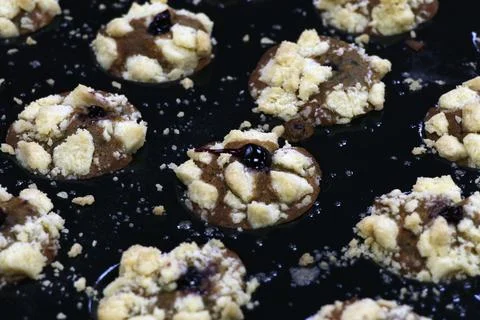 Chocolate stuffed baked muffins or cupcakes in a bakery sheet Stock Photos