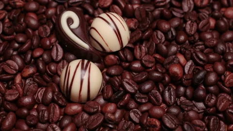 Chocolate sweets on a background of coffee beans Stock Footage 165840811