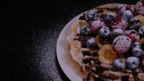 Chocolate Syrup Being Poured Over Belgian Waffles With Raspberries And Syrup 4K Stock-Footage 131126989