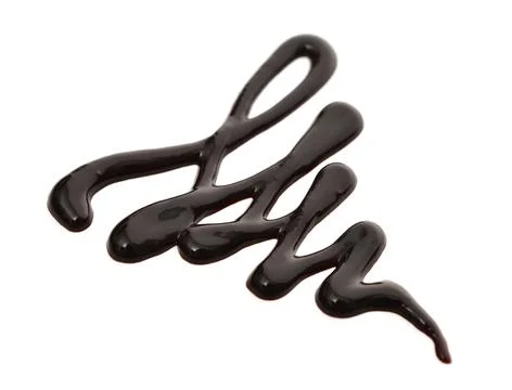 Chocolate syrup drip Stock Photos